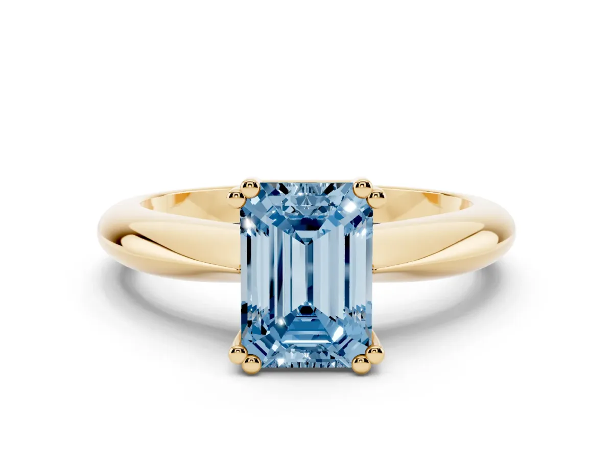 Fancy Blue Emerald Cut Cut Solitaire Engagement Ring with Tapered Band and Four-Prong Setting Yellow gold