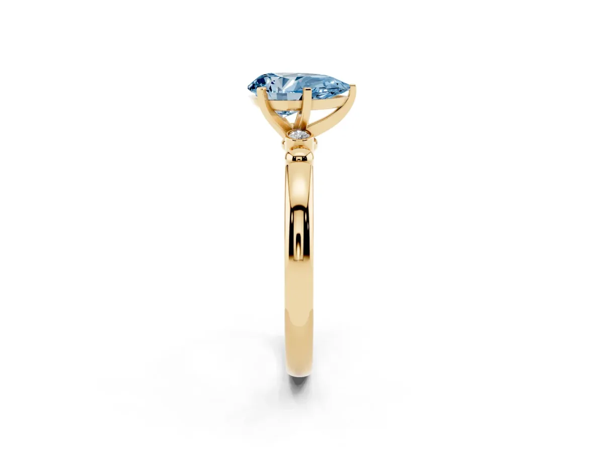 Fancy Blue Pear Cut Solitaire Beaded Band with Four-Prong Setting Yellow gold