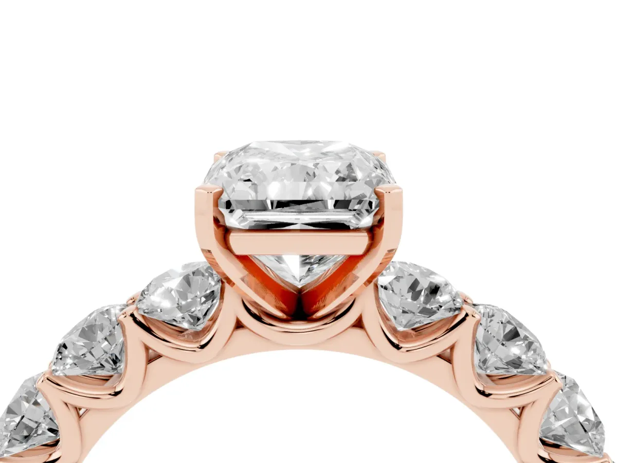 Radiant Cut Diamond Prong Setting with Side Stones on a Pave Band Rose gold