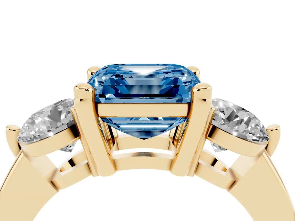 Fancy Blue Three-Stone Asscher Cut Brilliant Cut Solitaire Ring with Prong Setting on a Classic Band Yellow gold