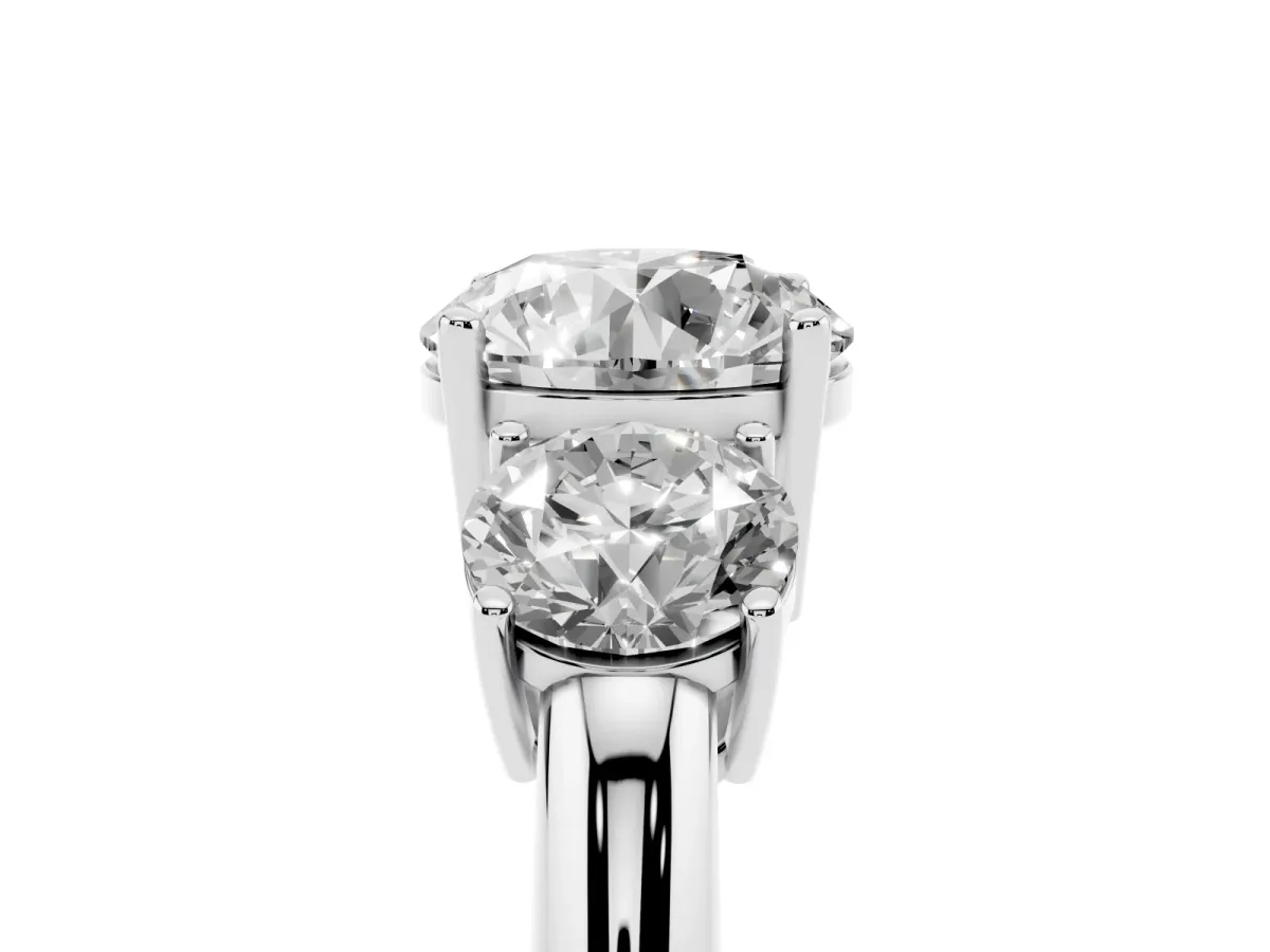 Three-Stone Round Cut Cut Diamond Engagement Ring with Prong Setting on a White Gold Band Platinum