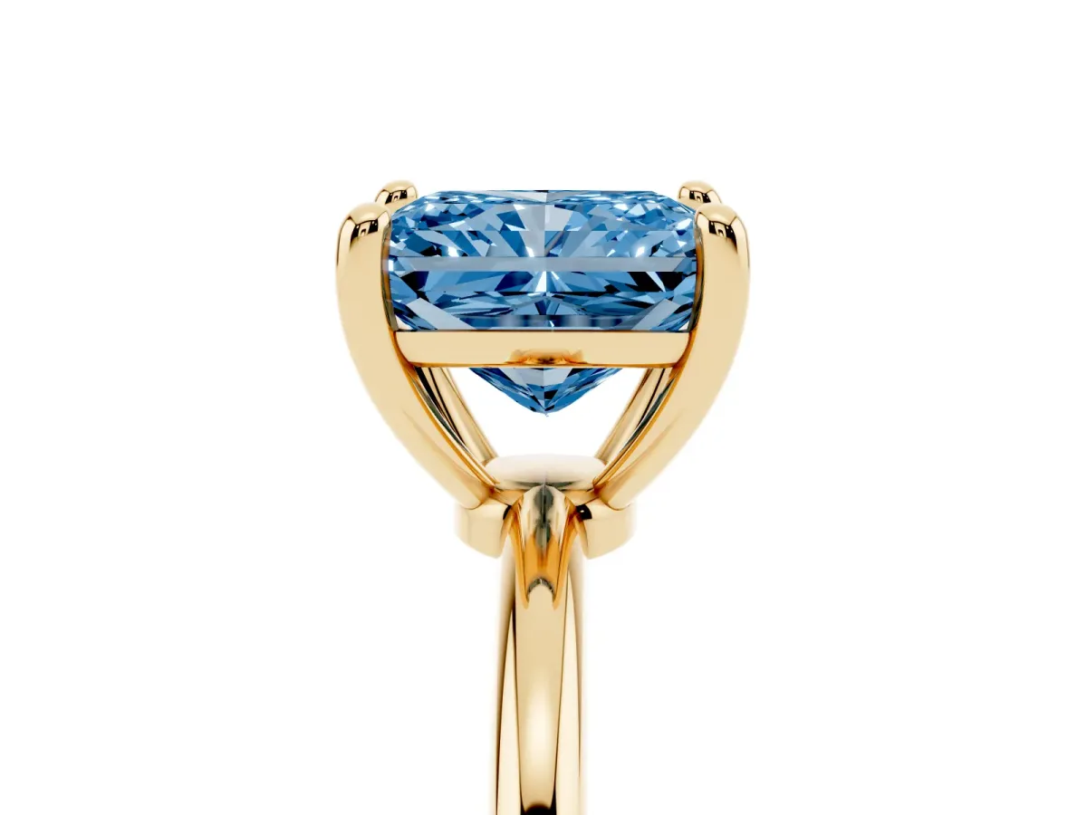 Fancy Blue Radiant Cut Solitaire Diamond Ring with 4-Prong Setting on a Classic Band Yellow gold