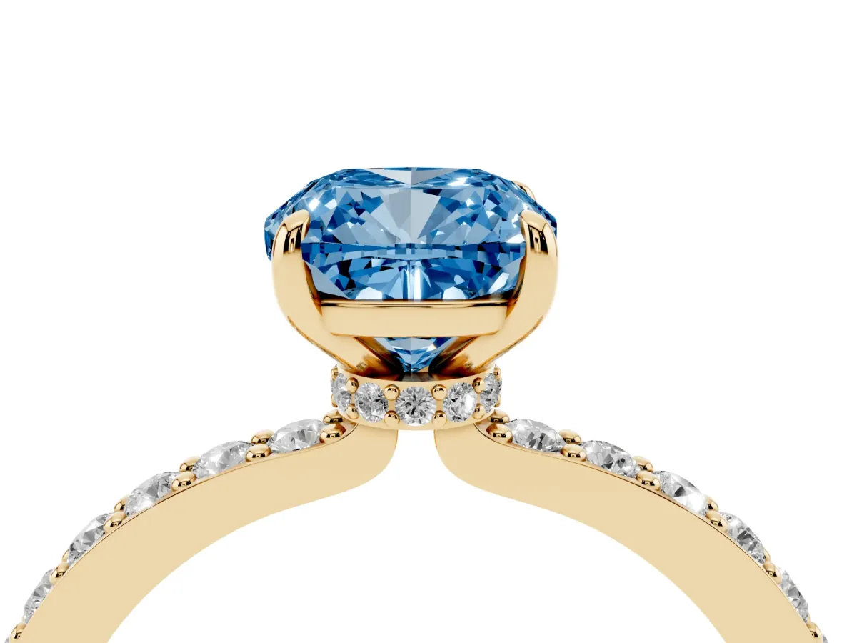 Fancy Blue Cushion Cut Diamond Pavé Engagement Ring with Round Accents and Prong Setting Yellow gold