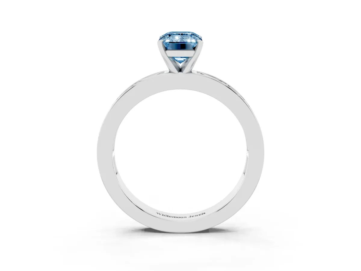 Fancy Blue Emerald Cut Solitaire Diamond Ring with Channel-Set Baguette Band and Four-Prong Setting White gold