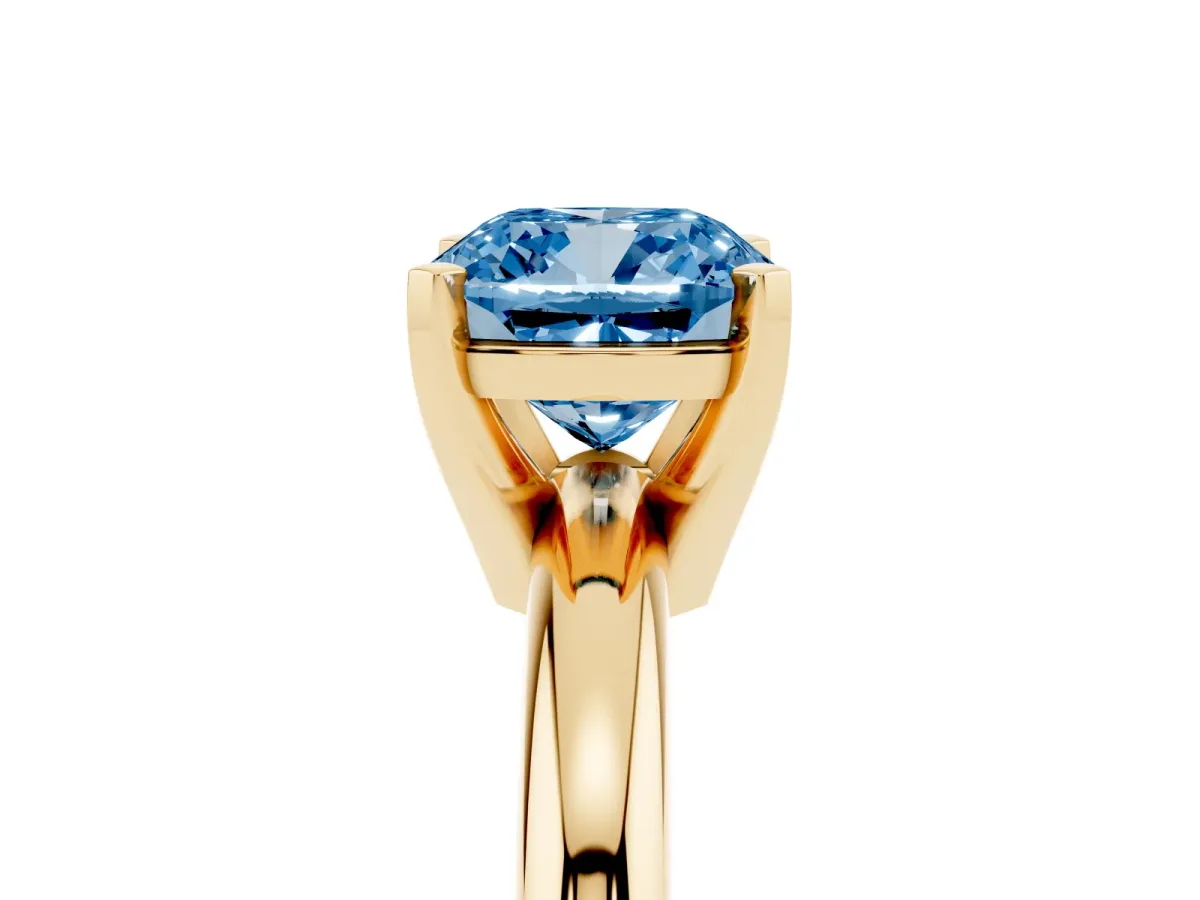 Fancy Blue Cushion Cut Diamond Solitaire Engagement Ring with Round Band and Four-Prong Setting Yellow gold