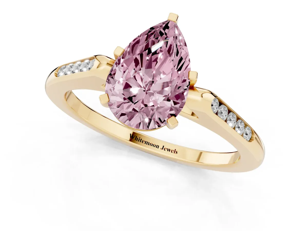 Fancy Pink Pear Cut Diamond Solitaire Ring with Channel Set Round Band and Prong Setting Yellow gold