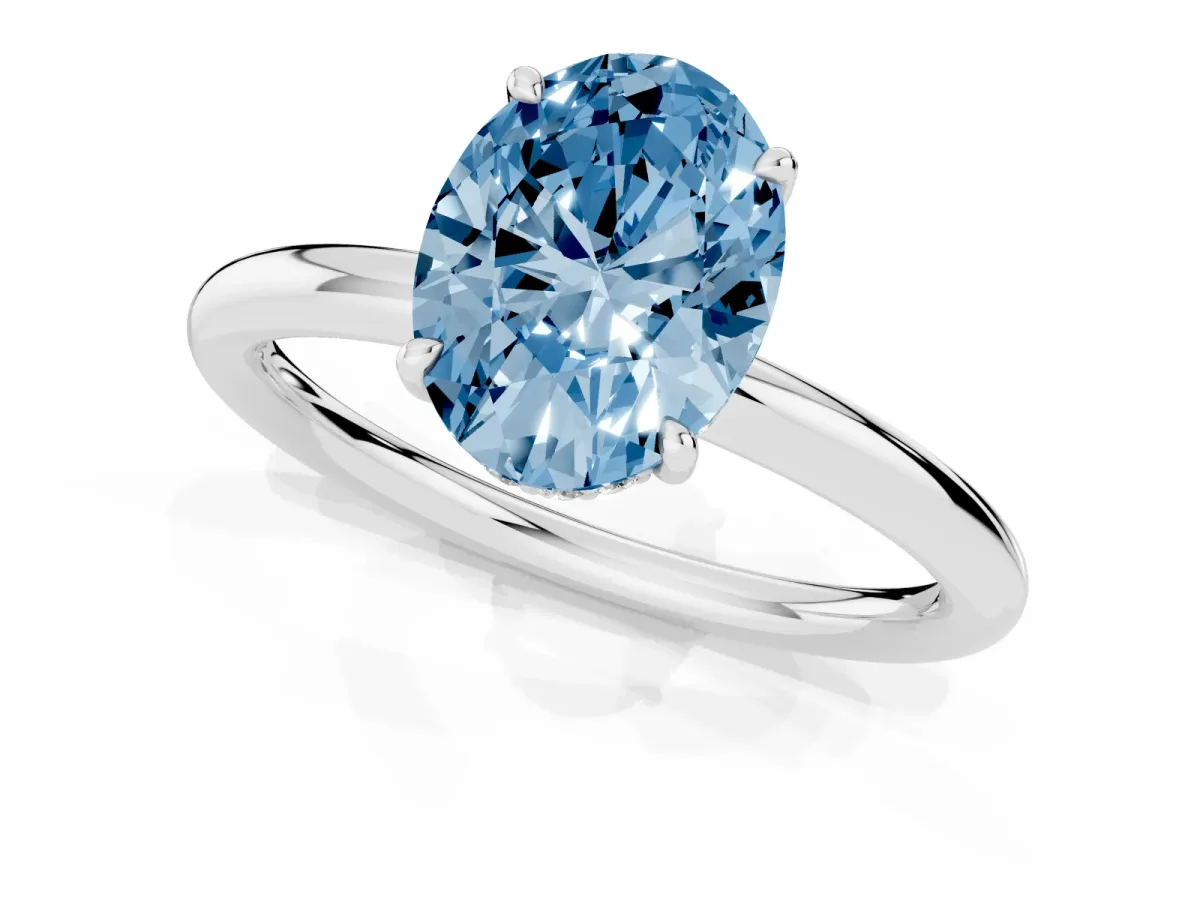 Fancy Blue Oval Cut Diamond Solitaire Ring with Thin Band and Four-Prong Setting Silver
