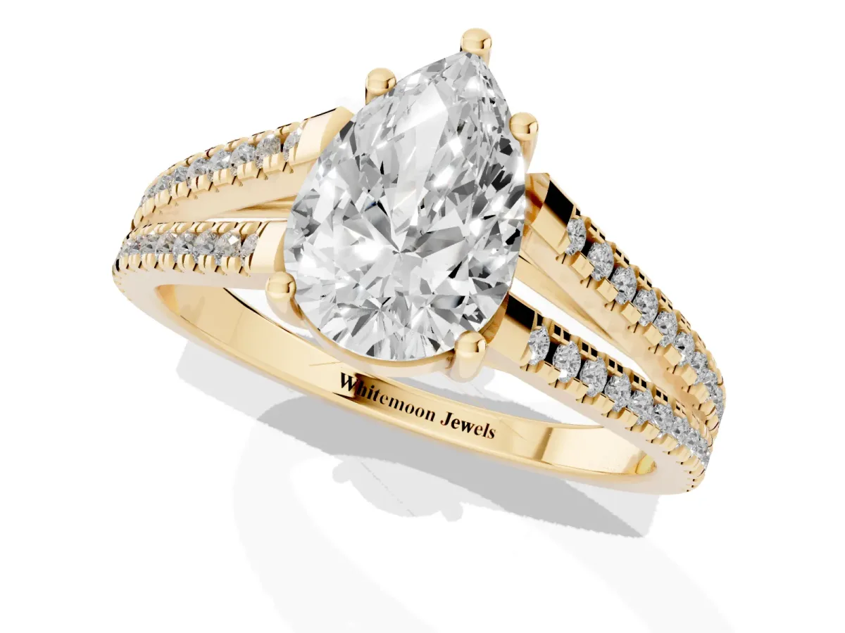 Pear Cut Diamond Solitaire Engagement Ring with Split Shank Pavé Band Yellow gold