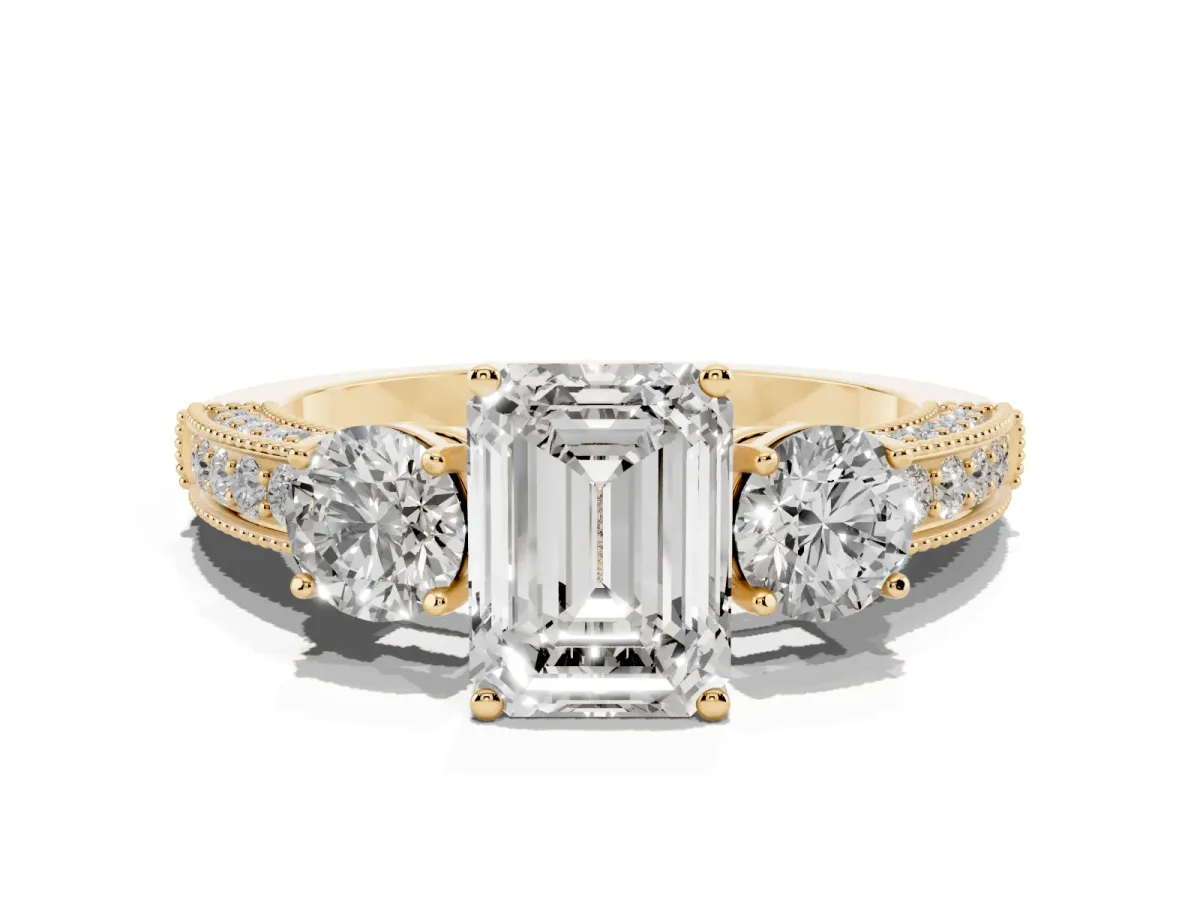 Emerald Cut Three-Stone Diamond Ring with Pavé Band and Four-Prong Setting Yellow gold