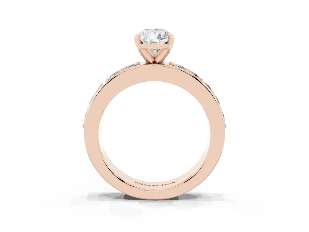 Pear Cut Diamond Engagement Ring with Channel Set Round Band and Prong Setting Rose gold