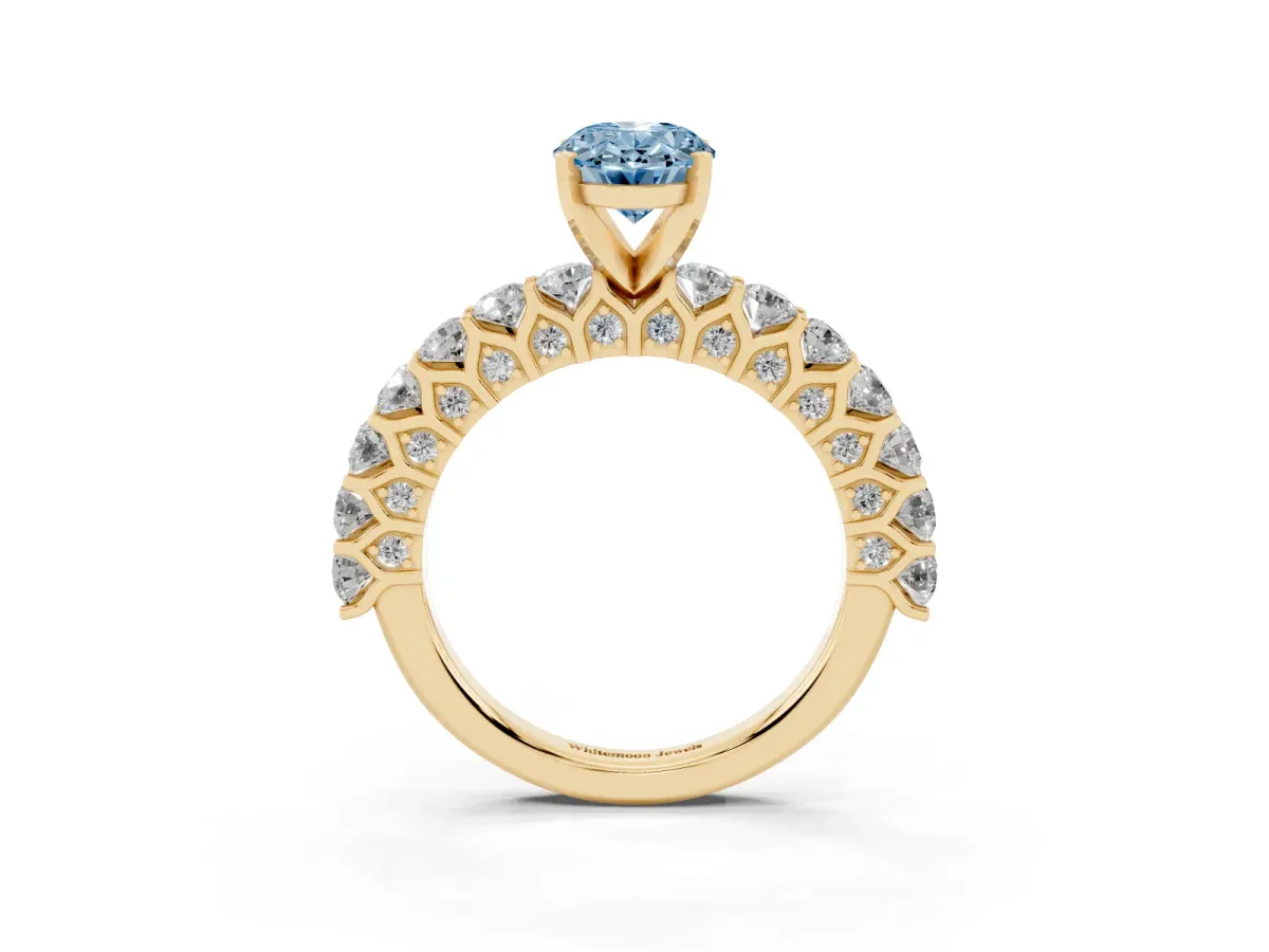 Fancy Blue Oval Cut Diamond Solitaire Ring with Shared Prong Pavé Band and Four-Prong Setting Yellow gold
