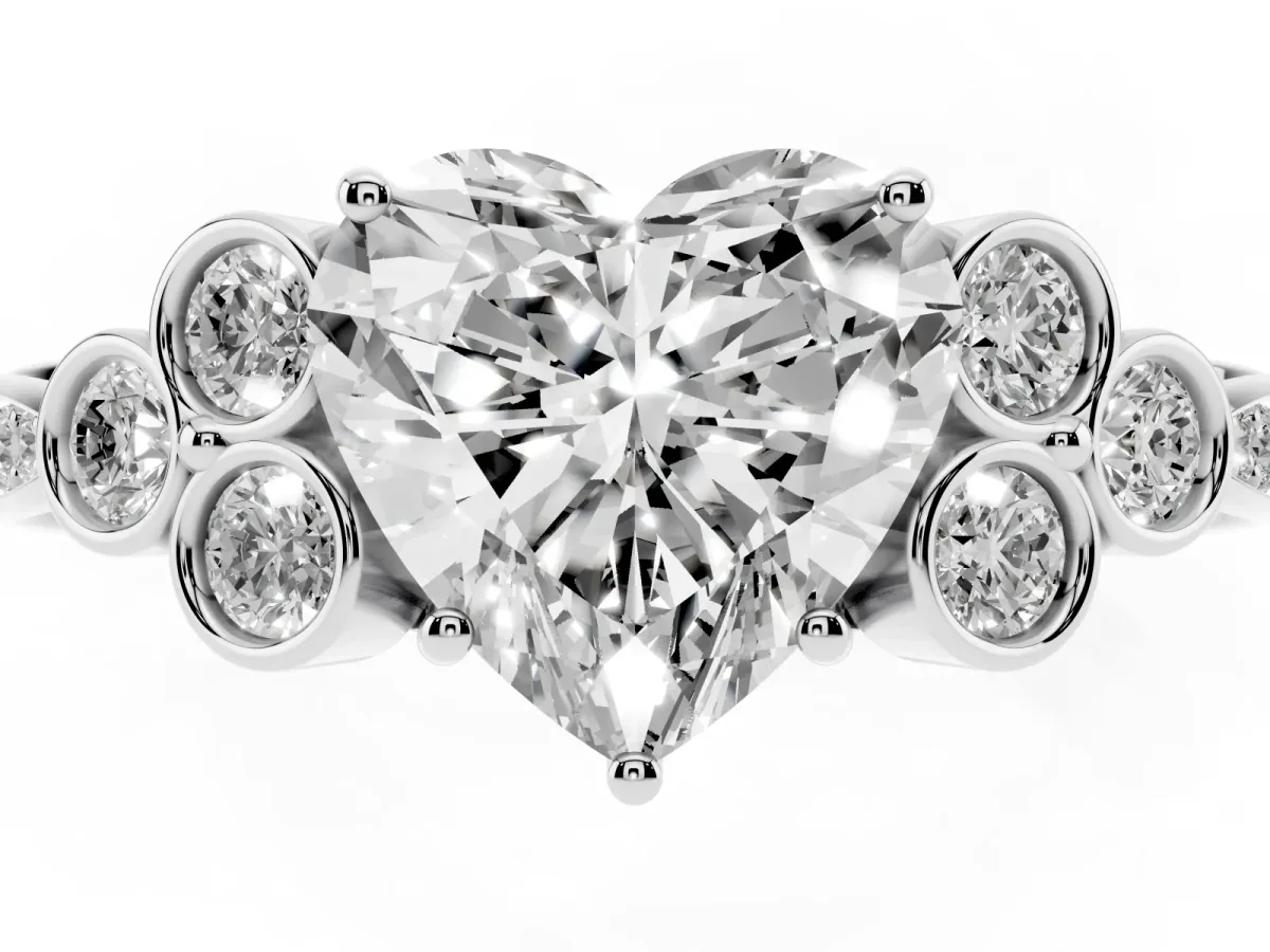 Heart Cut Cut Diamond Engagement Ring with Bezel Set Round Side Stones and Prong Setting Silver
