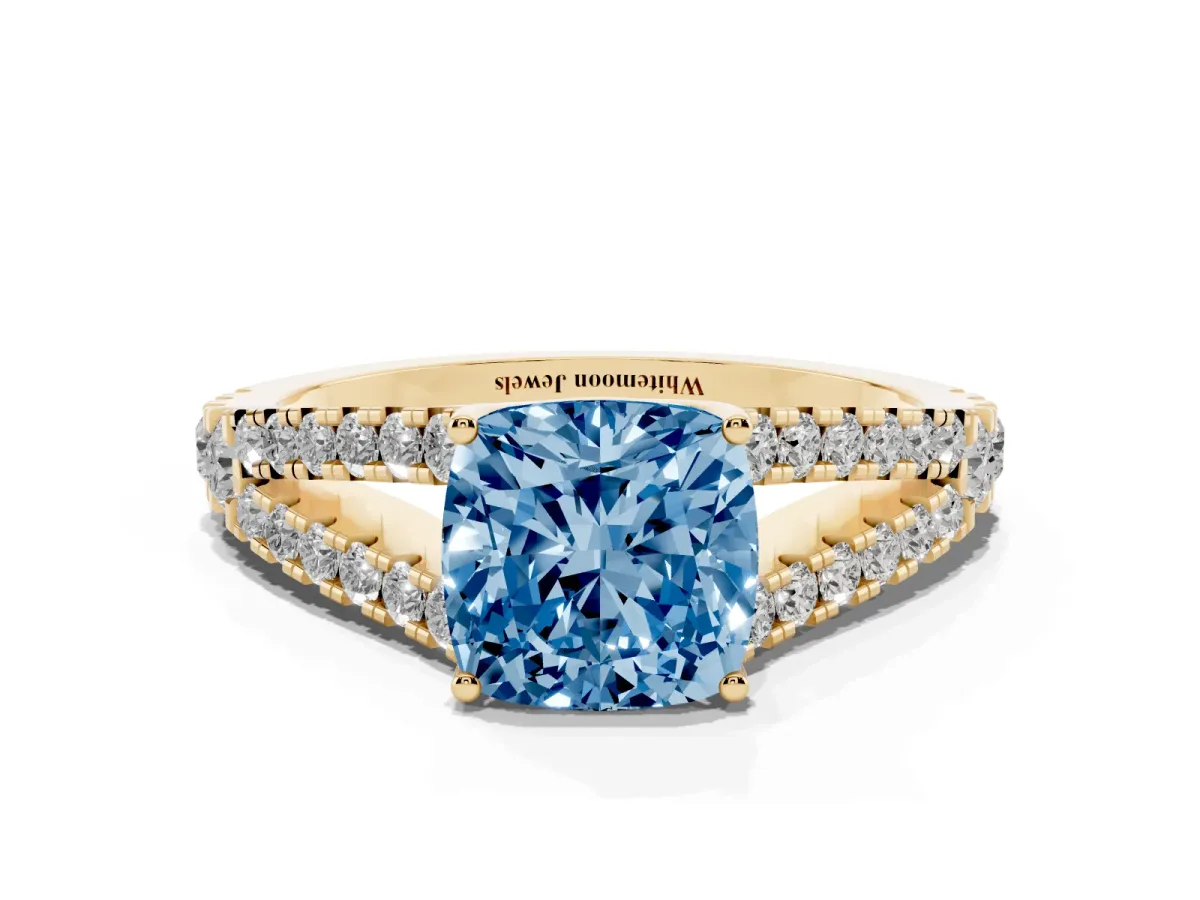 Fancy Blue Cushion Cut Diamond Split Shank Pavé Engagement Ring with Four-Prong Setting Yellow gold