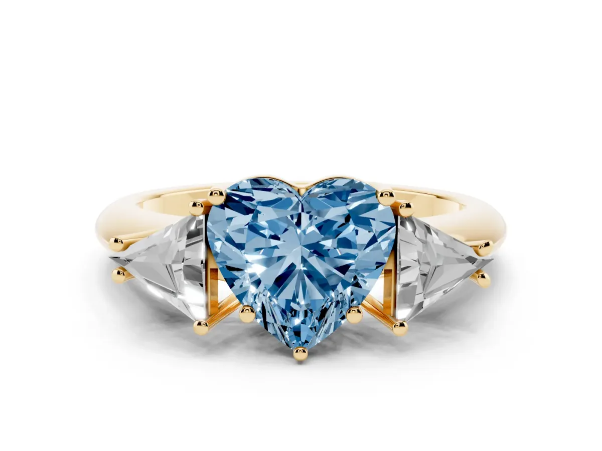 Fancy Blue Three-Stone Heart Cut Diamond Engagement Ring with Trillion Side Stones and Prong Setting Yellow gold
