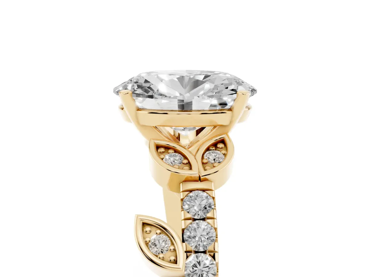 Oval Cut Solitaire Leaf-Inspired Diamond Ring with Pavé Band and Four-Prong Setting Yellow gold