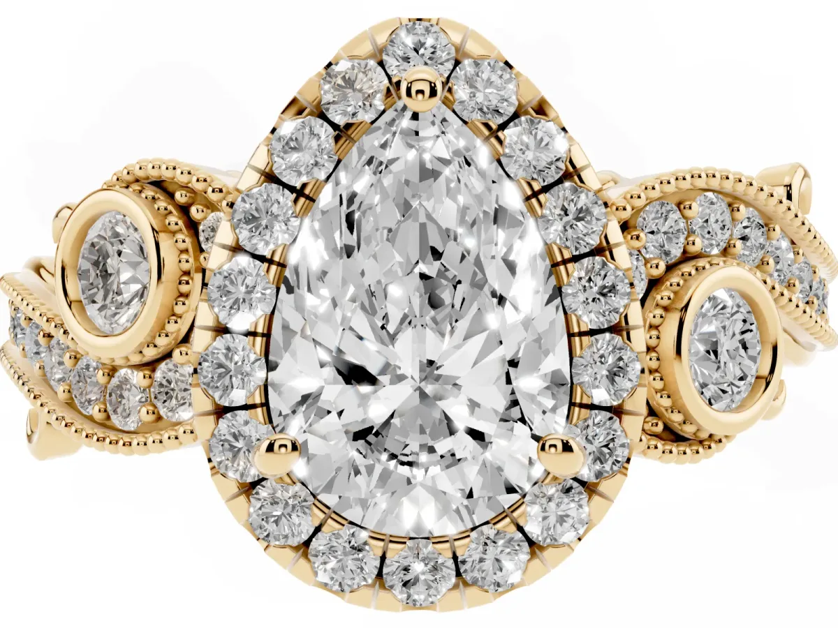Pear Cut Halo Diamond Ring with Milgrain and Bezel Accents on a Split Shank Band Yellow gold