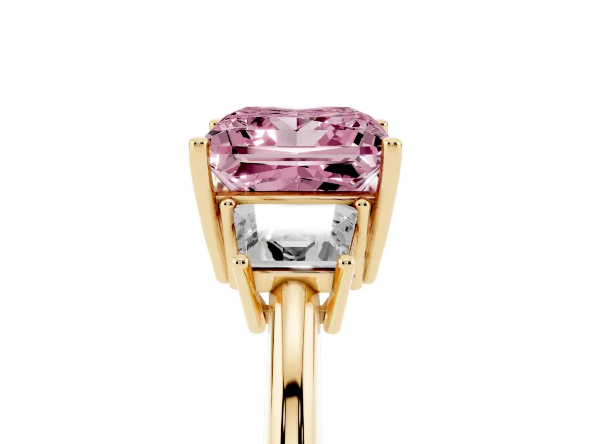 Fancy Pink Princess Cut Diamond Three-Stone Ring with Trapezoid Side Stones and Prong Setting Yellow gold