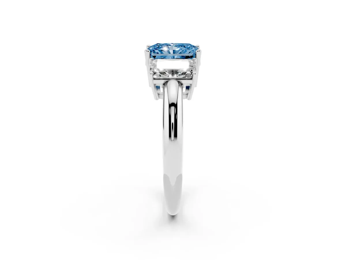 Fancy Blue Three-Stone Radiant Cut Cut Diamond Engagement Ring with Prong Setting on a White Gold Band Silver