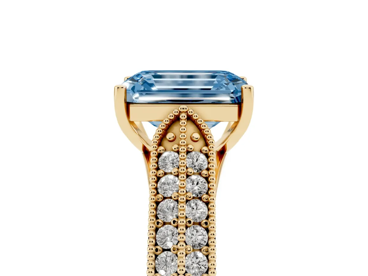 Fancy Blue Emerald Cut Cut Pave Split Shank Engagement Ring with Four-Prong Setting Yellow gold
