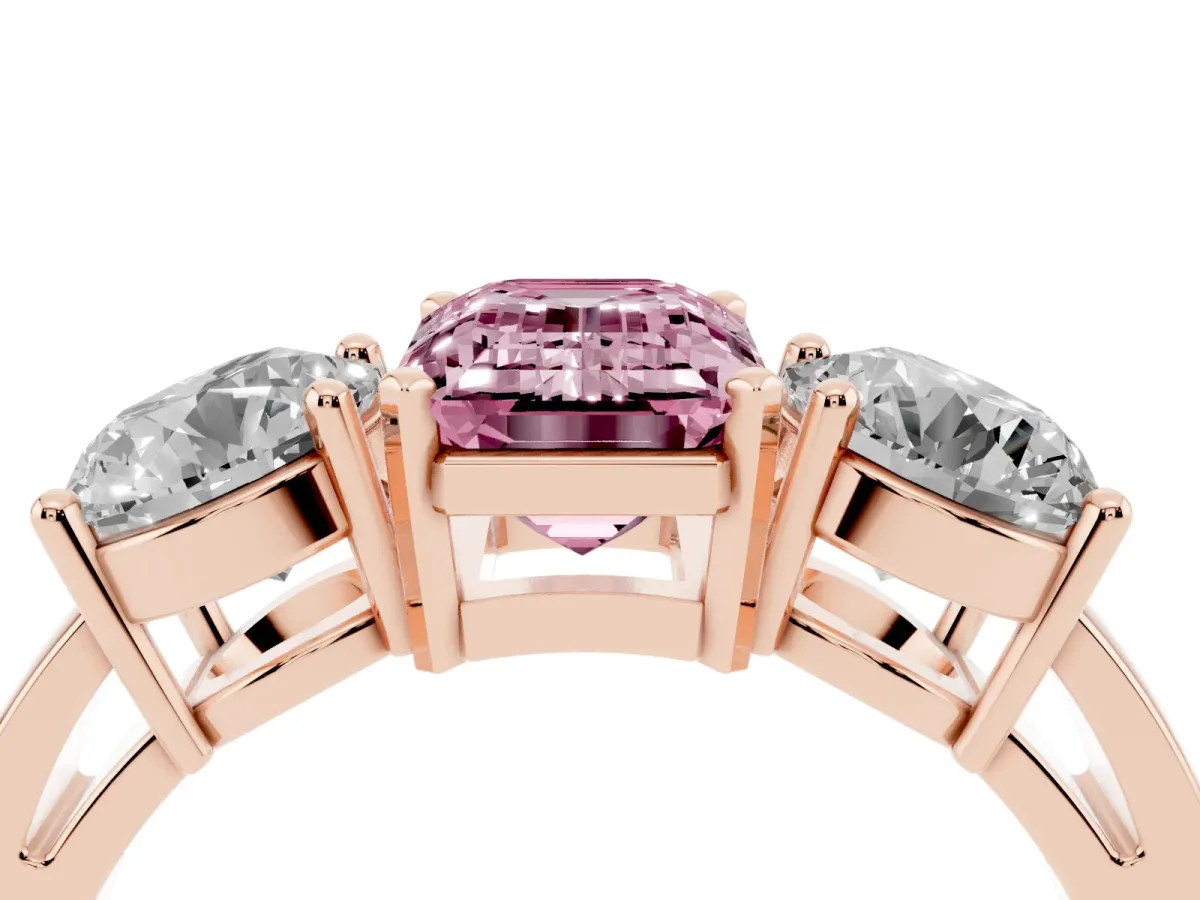 Fancy Pink Three-Stone Emerald Cut Diamond Ring with Round Side Stones, Classic Band, and Four-Prong Setting Rose gold