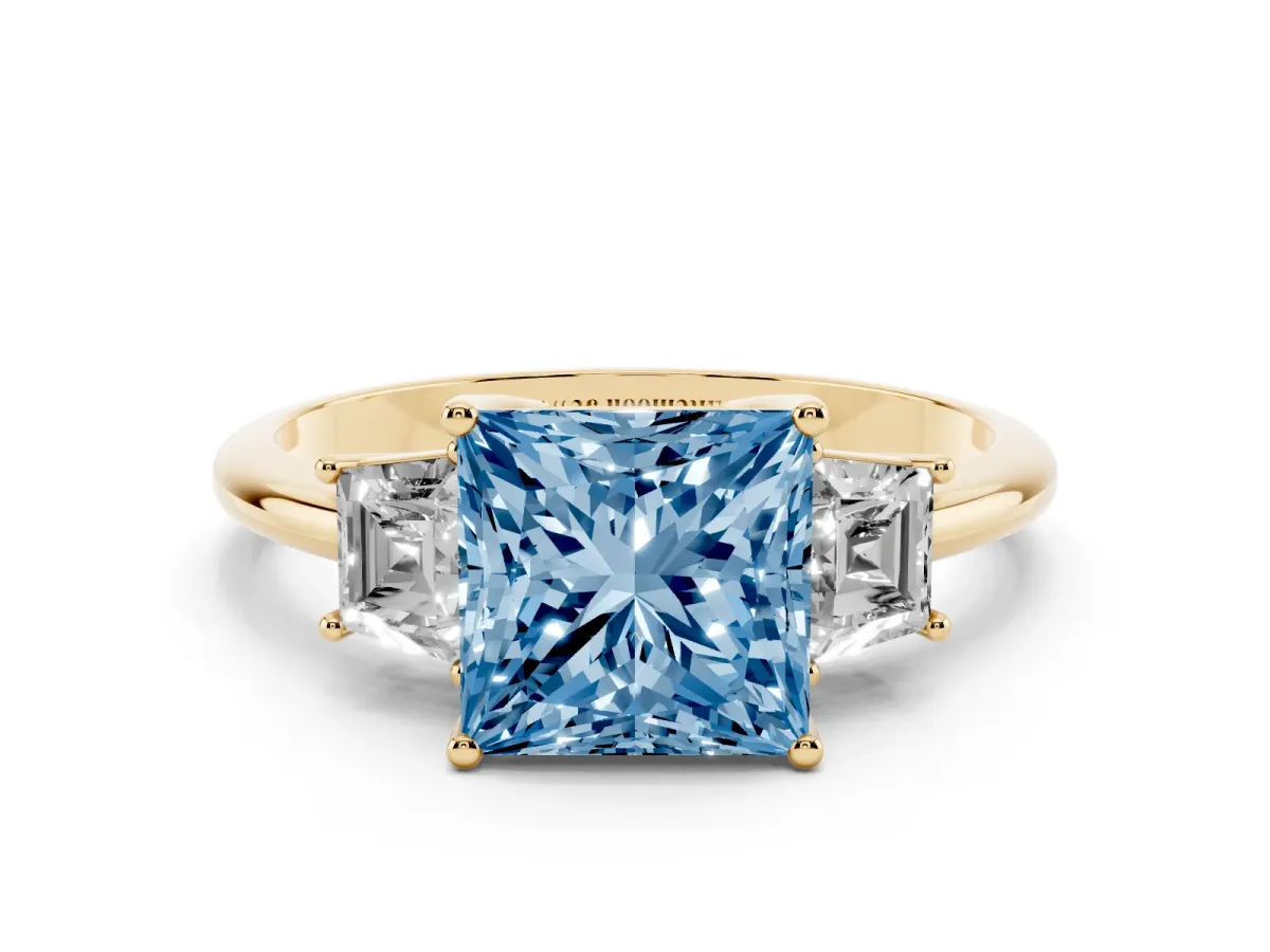 Fancy Blue Princess Cut Diamond Three-Stone Ring with Trapezoid Side Stones and Prong Setting Yellow gold
