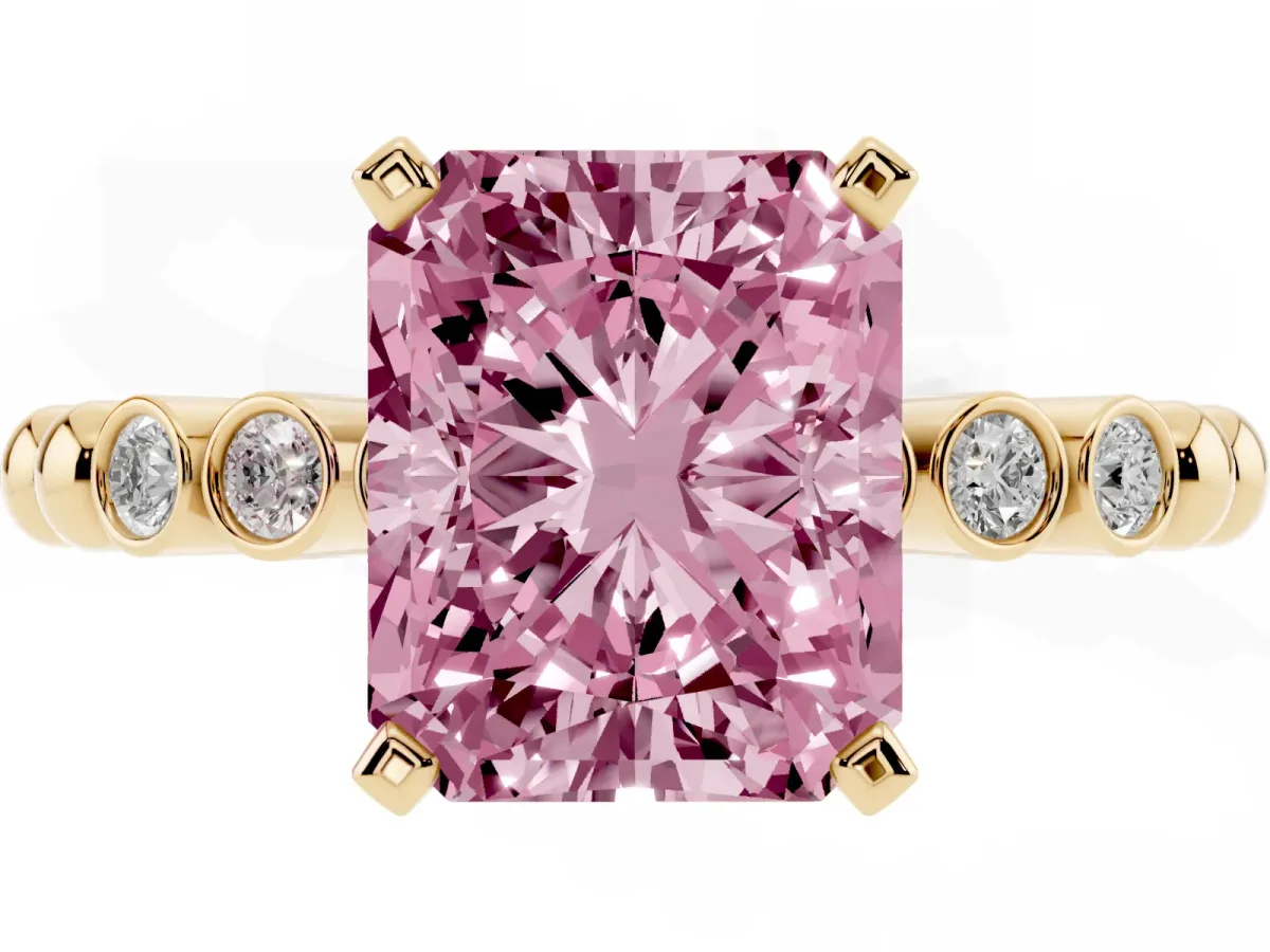 Fancy Pink Radiant Cut Solitaire Bezel Accent Diamond Engagement Ring with Beaded Band and Four-Prong Setting Yellow gold