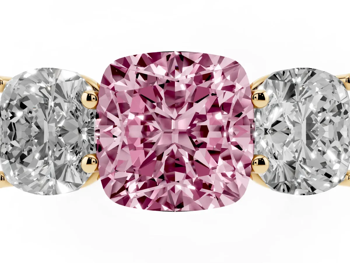 Fancy Pink Cushion Cut Three-Stone Diamond Ring with Prong Setting on a Classic Band Yellow gold