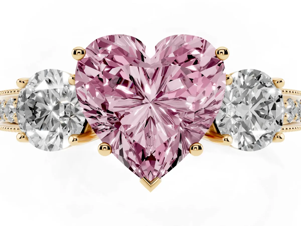 Fancy Pink Heart Cut Three-Stone Diamond Ring with Pavé Band and Four-Prong Setting Yellow gold