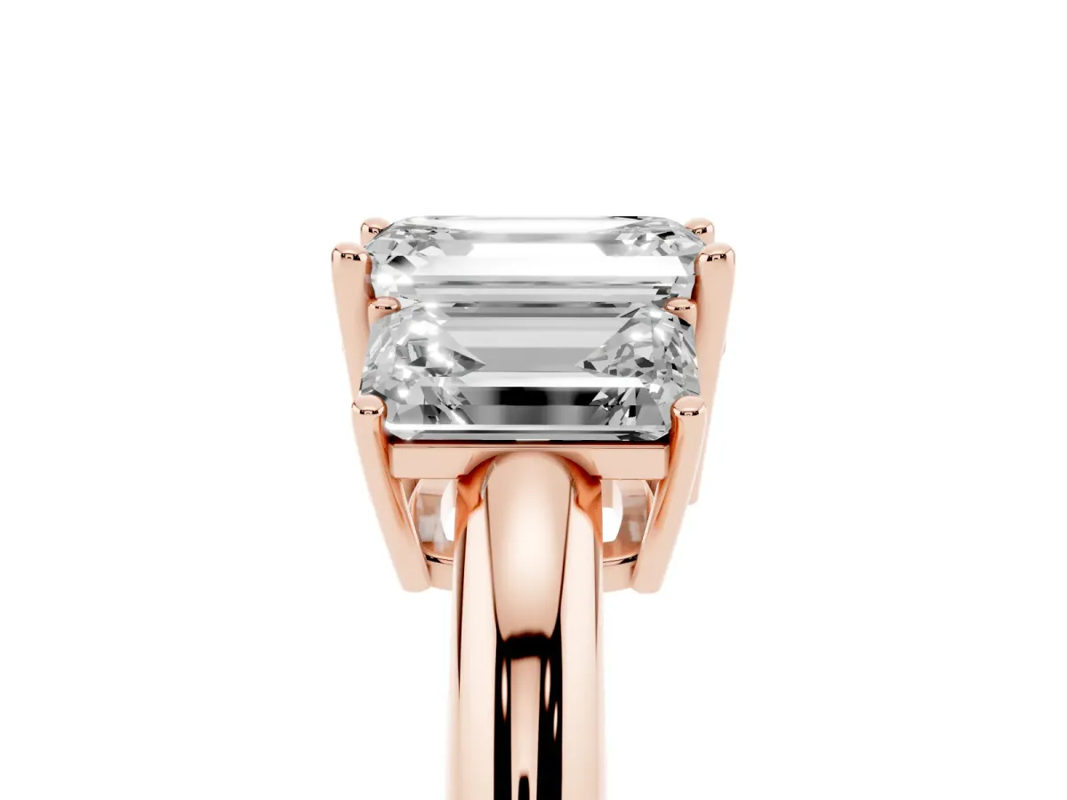 Three-Stone Emerald Cut Cut Diamond Engagement Ring with Prong Setting on a White Gold Band Rose gold