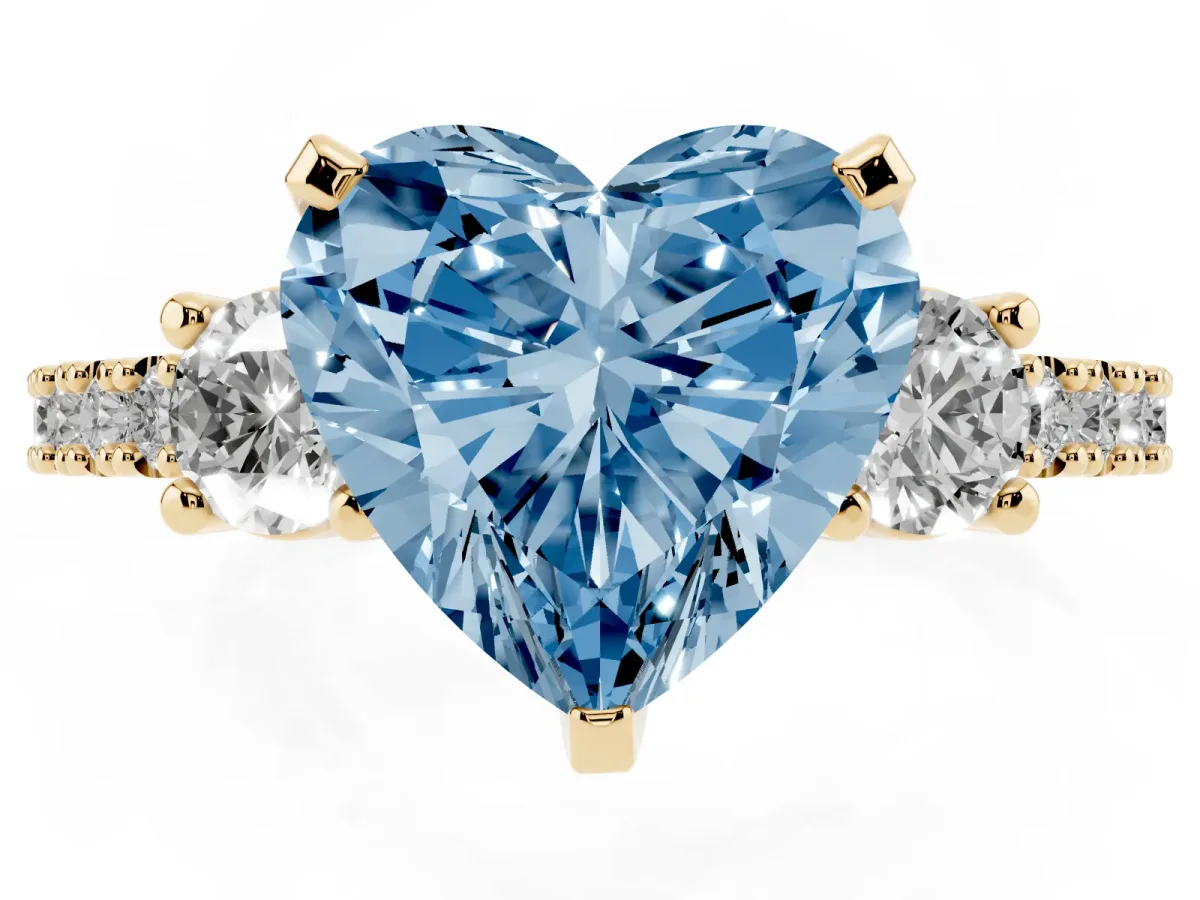 Fancy Blue Heart Cut Three-Stone Diamond Pavé Band with Prong Setting Yellow gold
