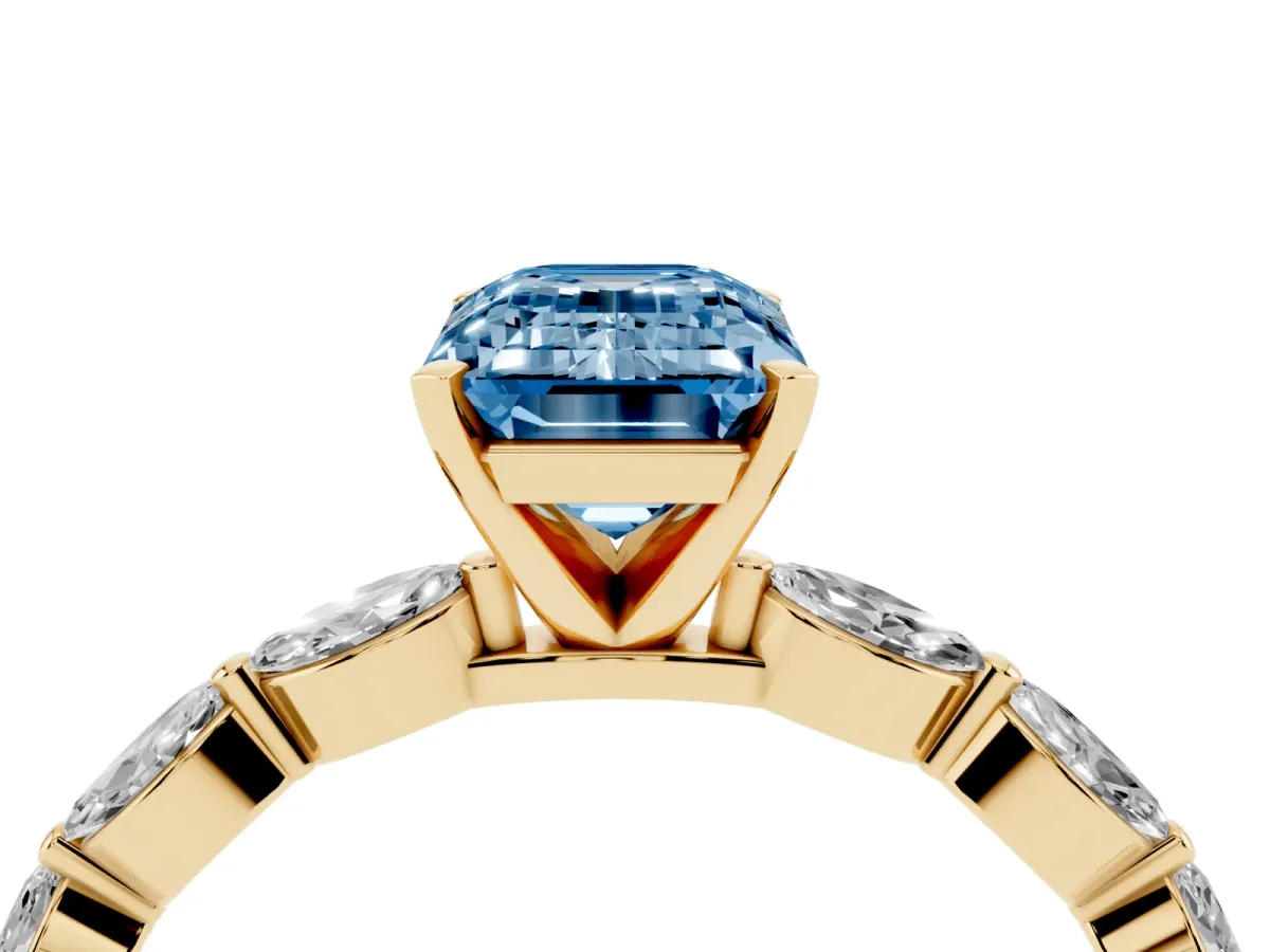 Fancy Blue Emerald Cut Diamond Ring with Marquise Side Stones and Prong Setting Yellow gold