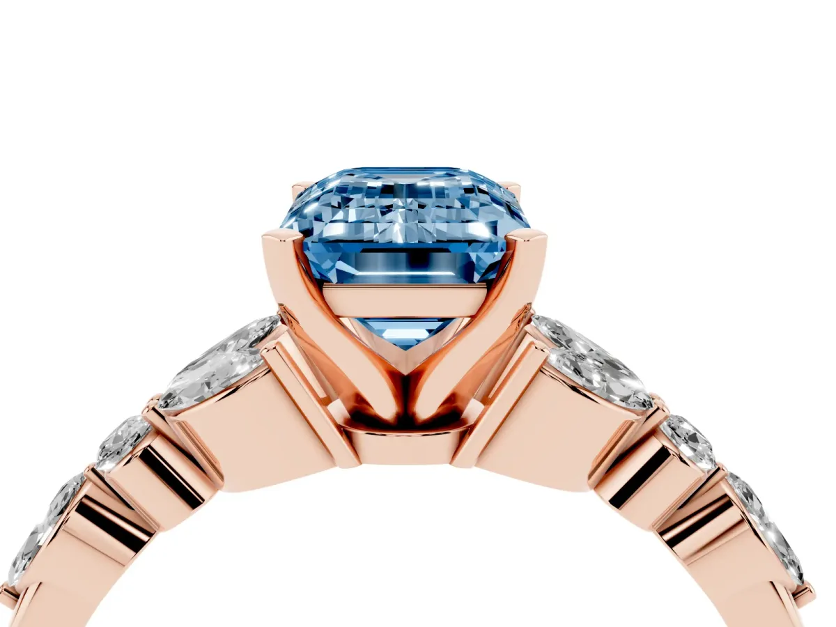 Fancy Blue Emerald Cut Diamond Solitaire Ring with Side Stones and Four-Prong Setting Rose gold