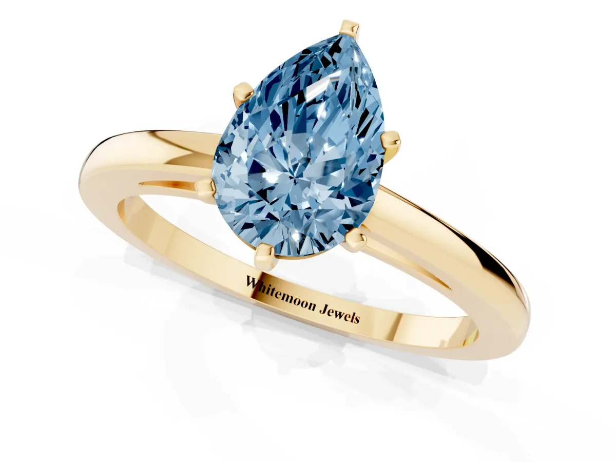 Fancy Blue Pear Cut Solitaire Diamond Engagement Ring with Four-Prong Setting on a Classic Band Yellow gold