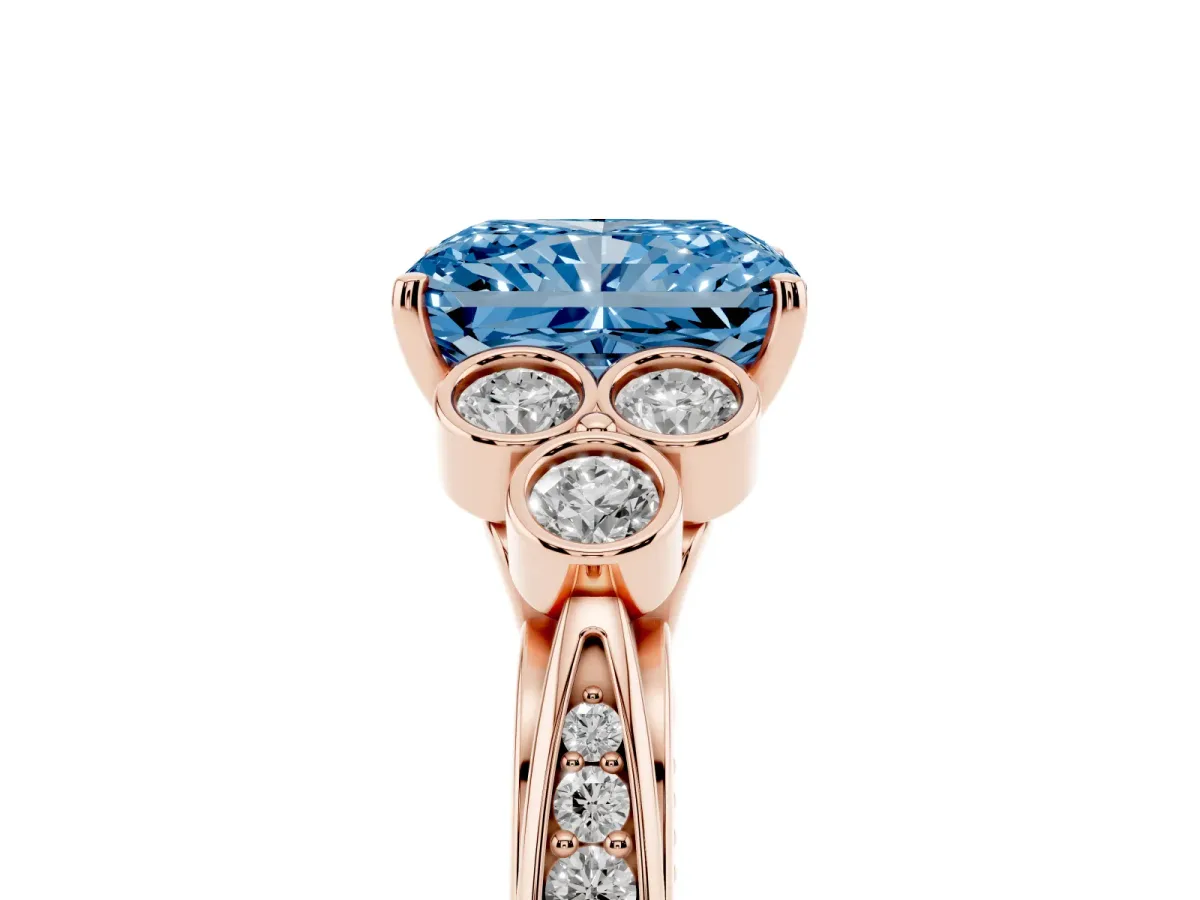 Fancy Blue Radiant Cut Cut Diamond Engagement Ring with Bezel Set Round Side Stones and Prong Setting Rose gold