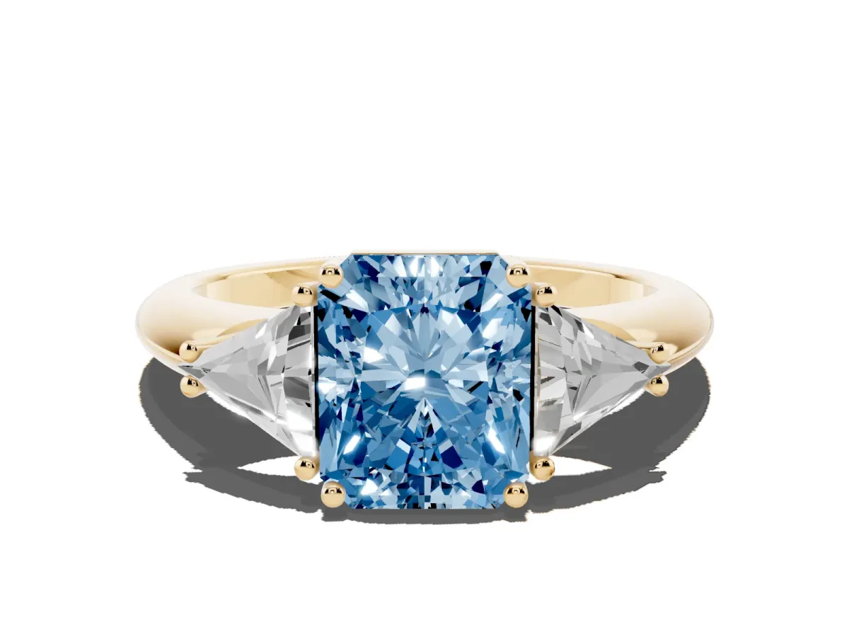 Fancy Blue Three-Stone Radiant Cut Diamond Engagement Ring with Trillion Side Stones and Prong Setting Yellow gold