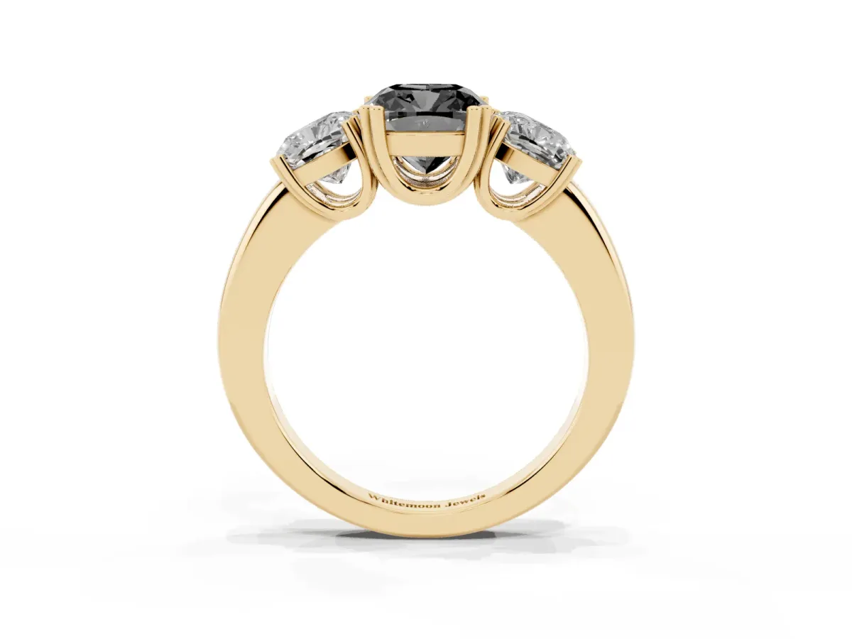 Fancy Black Three-Stone Cushion Cut Cut Diamond Ring with Channel Set Band and Four-Prong Setting Yellow gold