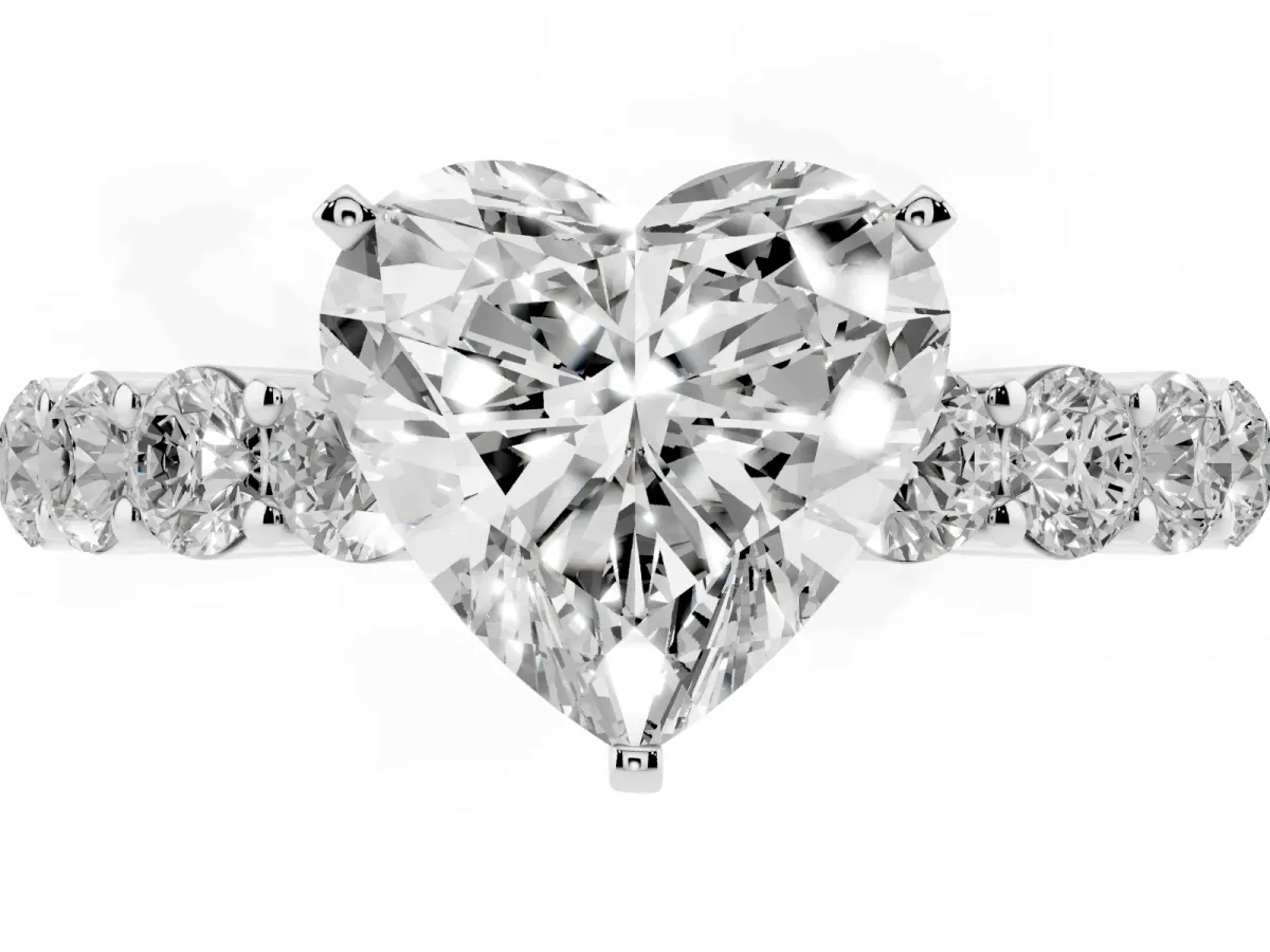 Heart Cut Diamond Solitaire Ring with Shared Prong Round Side Stones Silver