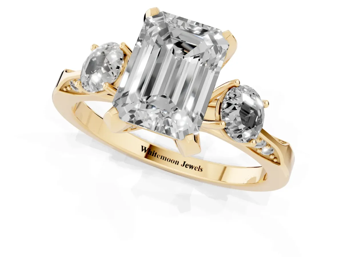 Emerald Cut Brilliant Three-Stone Diamond Ring with Pavé Band and Four-Prong Setting Yellow gold