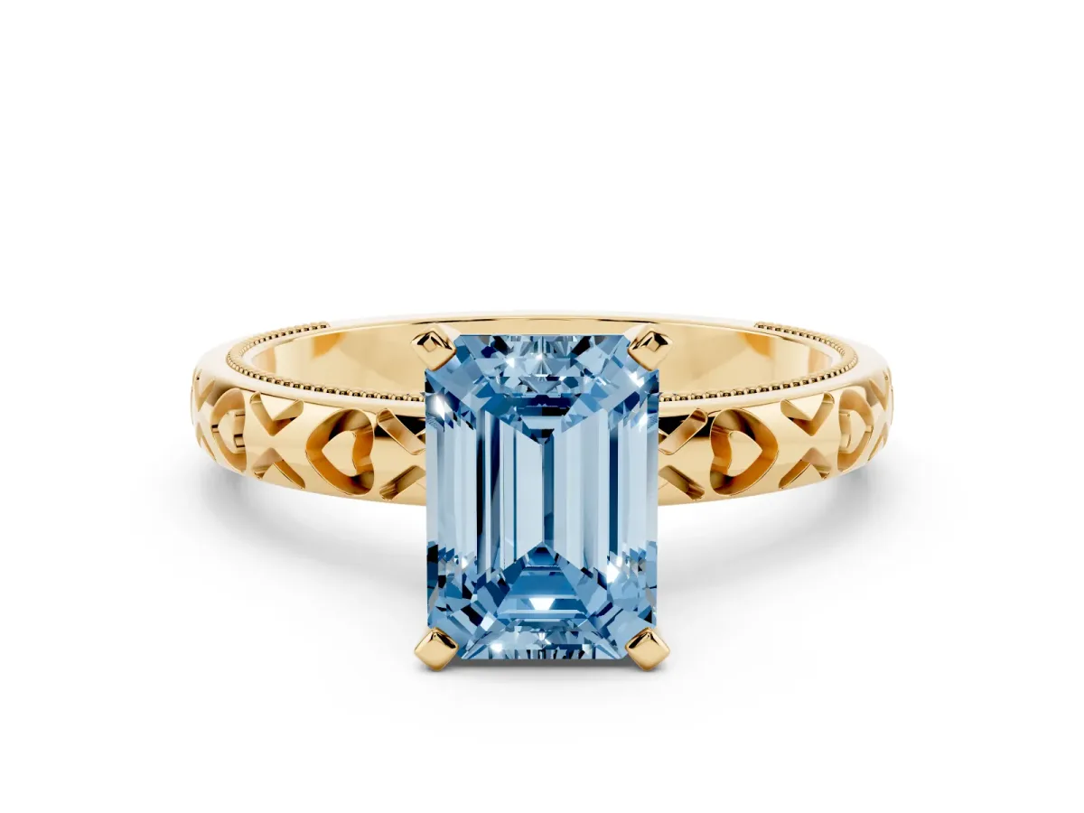 Fancy Blue Emerald Cut Solitaire Diamond Engagement Ring with XO Engraved Band and Four-Prong Setting Yellow gold