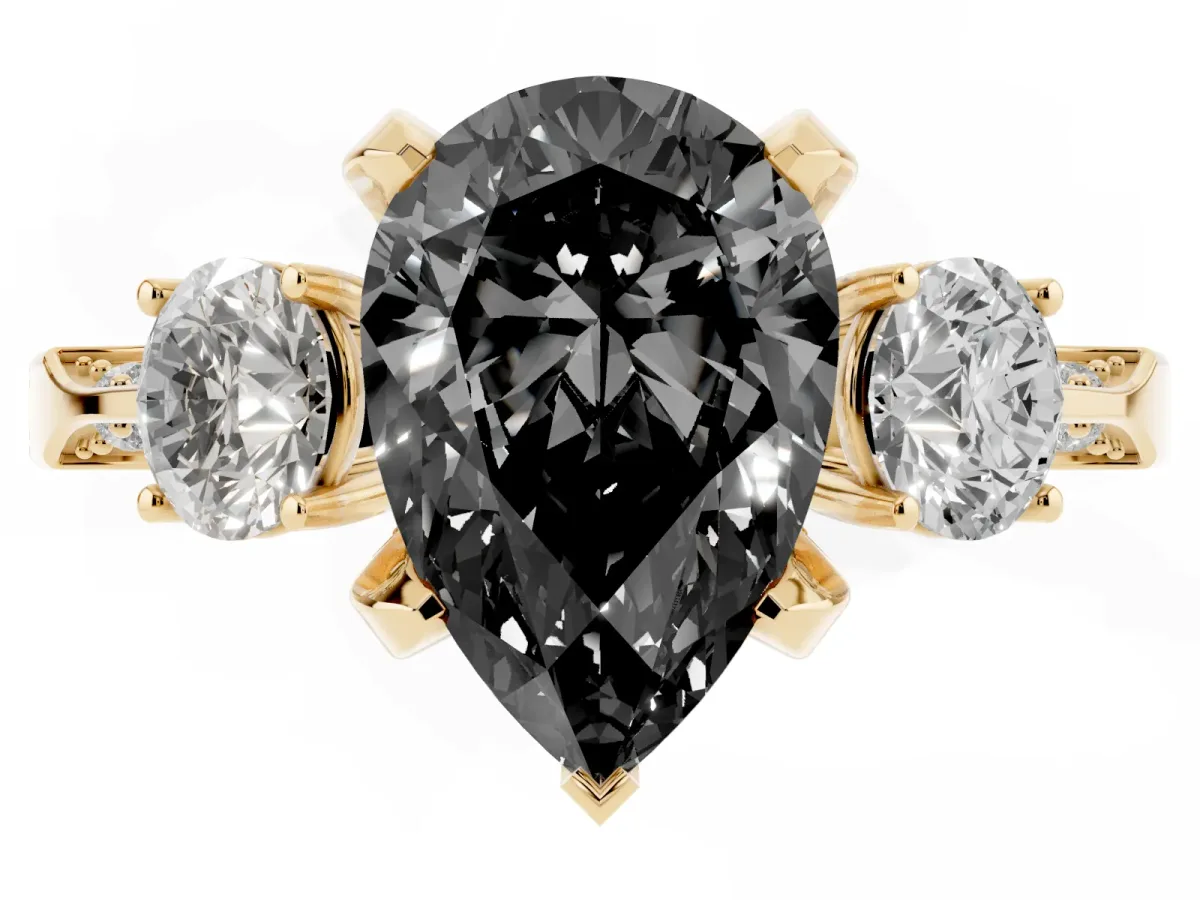 Fancy Black Pear Cut Brilliant Three-Stone Diamond Ring with Pavé Band and Four-Prong Setting Yellow gold