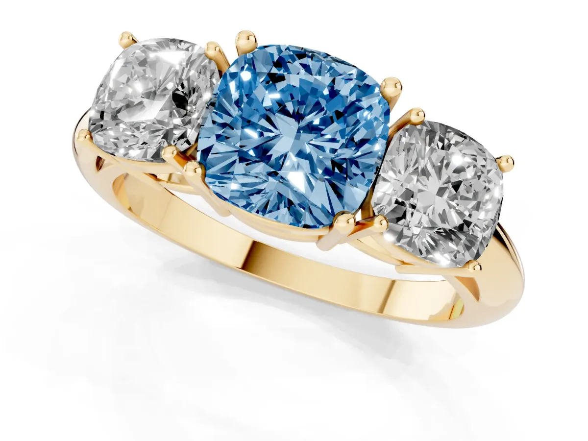 Fancy Blue Three-Stone Cushion Cut Cut Diamond Engagement Ring with Prong Setting on a White Gold Band Yellow gold