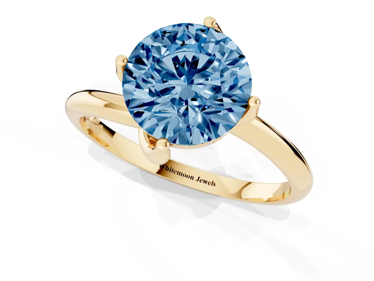 Fancy Blue Round Cut Diamond Solitaire Engagement Ring with Four-Prong Setting and Classic Band Yellow gold