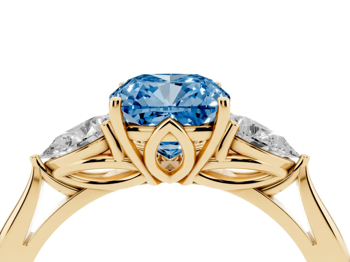 Fancy Blue Cushion Cut Diamond Three-Stone Ring with Pear Side Stones and Prong Setting Yellow gold