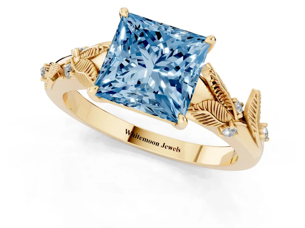 Fancy Blue Princess Cut Diamond Solitaire Ring with Leaf Motif Band and Four-Prong Setting Yellow gold