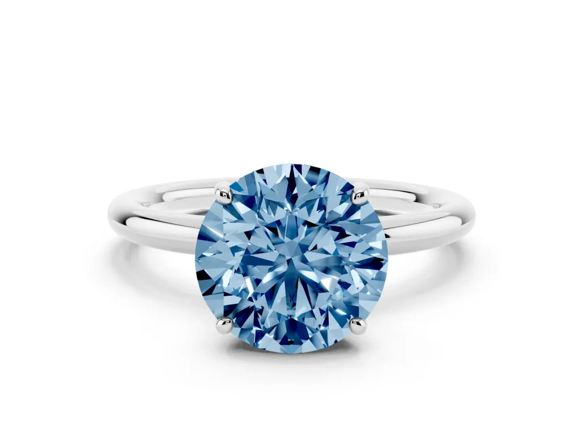 Fancy Blue Round Cut Solitaire Diamond Ring with Four-Prong Setting on a Plain Band Silver