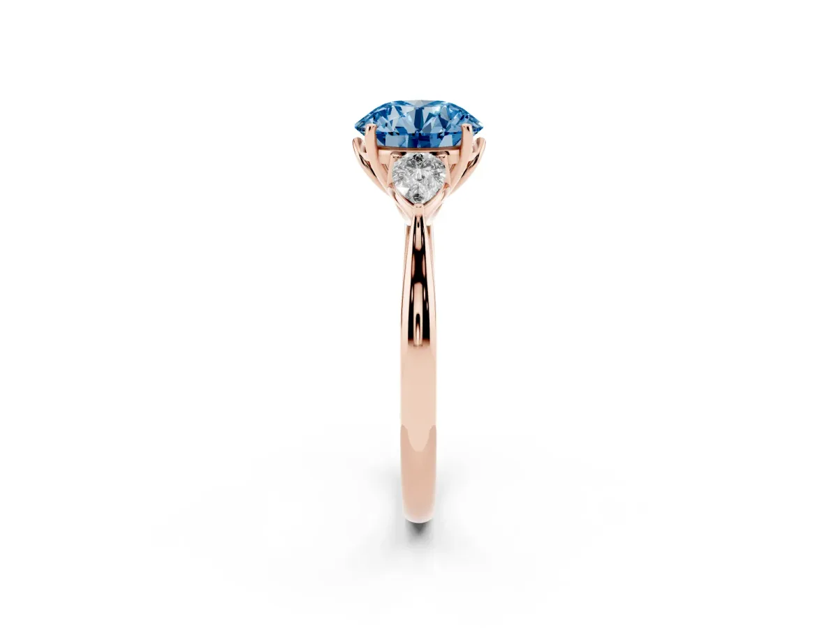 Fancy Blue Three-Stone Round Cut Diamond Ring with Pear Side Stones in Four-Prong Setting Rose gold