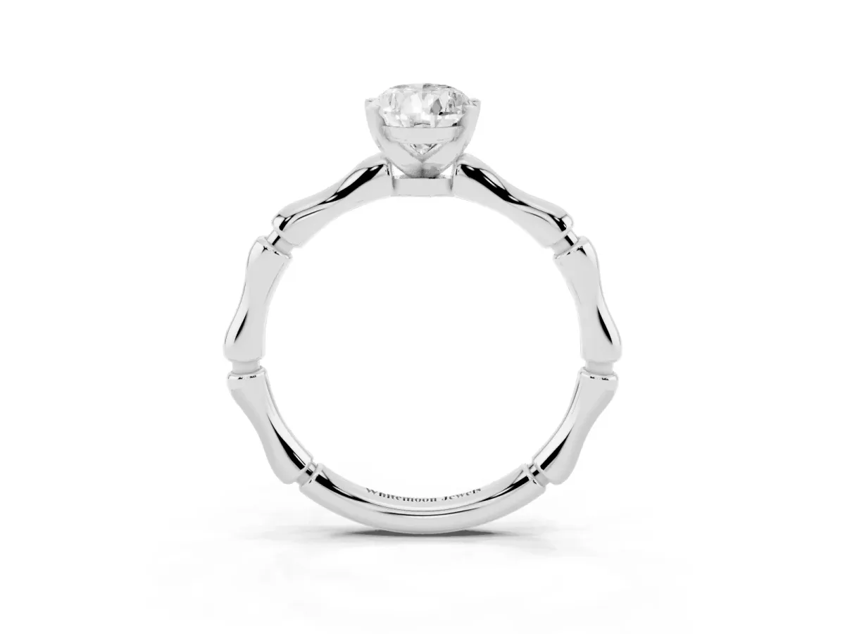 Pear Cut Solitaire Diamond Ring with Bamboo Band and Four-Prong Setting Platinum