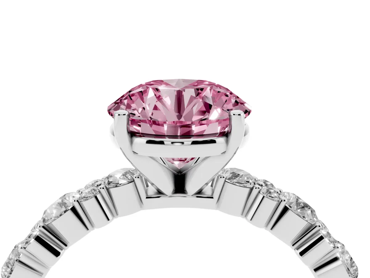 Fancy Pink Round Cut Diamond Side Stone Solitaire Ring with Round and Four-Prong Setting Platinum