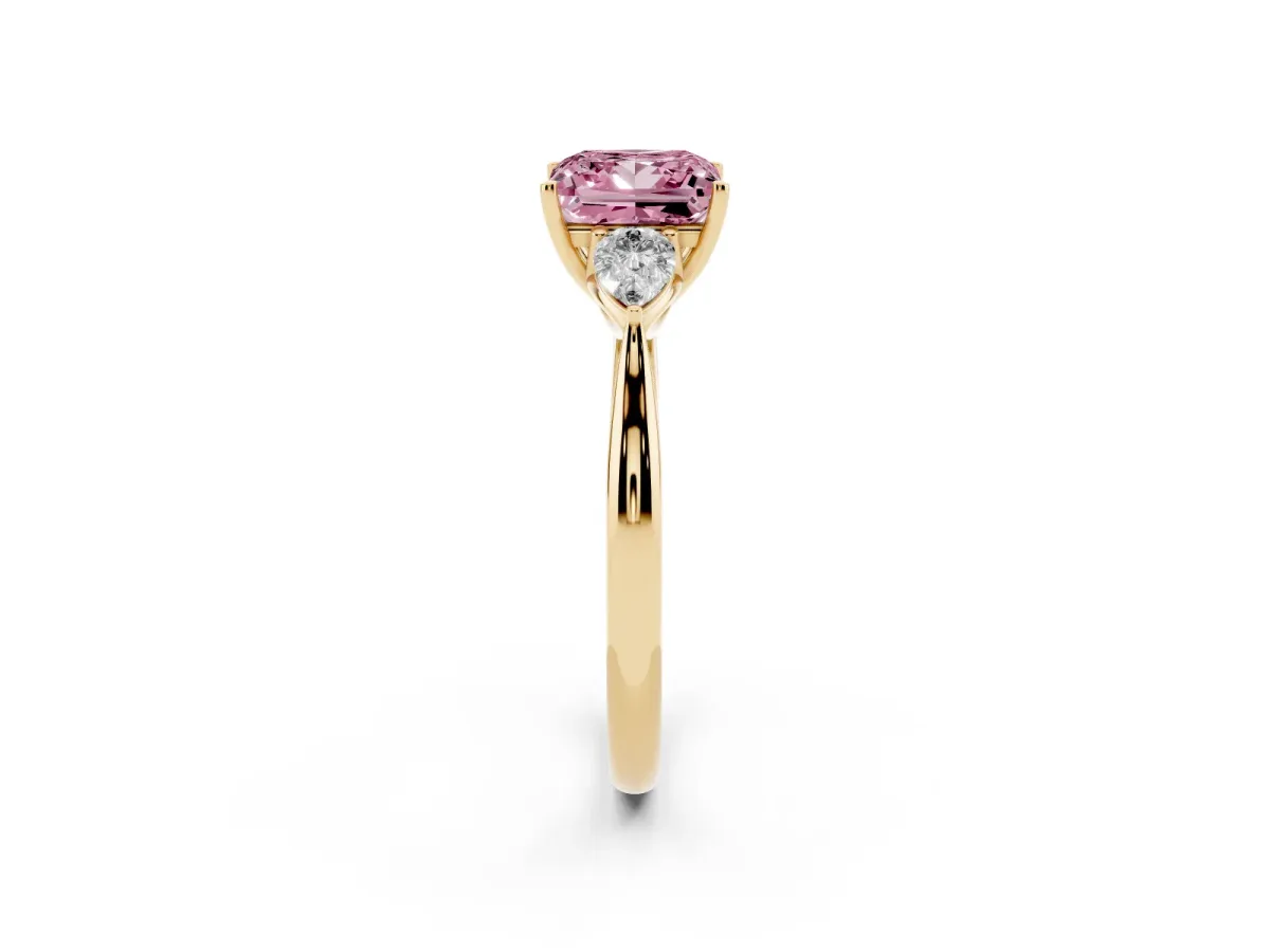 Fancy Pink Three-Stone Princess Cut Diamond Ring with Pear Side Stones in Four-Prong Setting Yellow gold