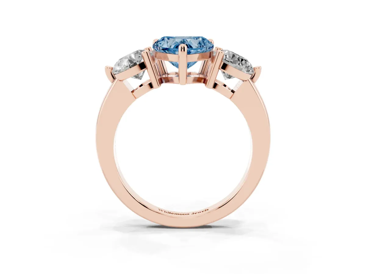 Fancy Blue Three-Stone Heart Cut Brilliant Cut Solitaire Ring with Prong Setting on a Classic Band Rose gold